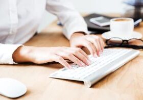 Womans hands on keyboard working