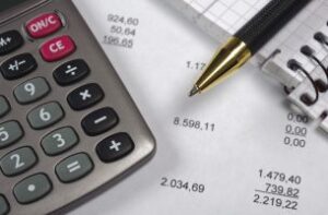 buget sheet with balance sheet and pen