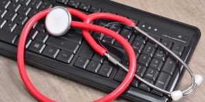 keyboard with stethoscope on it